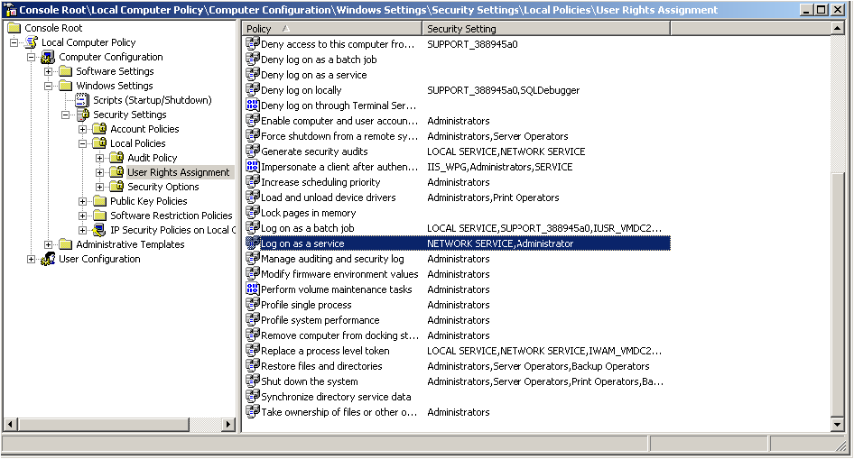 Microsoft Management Console window displaying Local Computer Policy section deployed with User Rights Assignment highlighted in the left panel and Log on as a service highlighted in the right panel